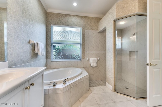 bathroom featuring vanity, tile patterned floors, ornamental molding, and plus walk in shower