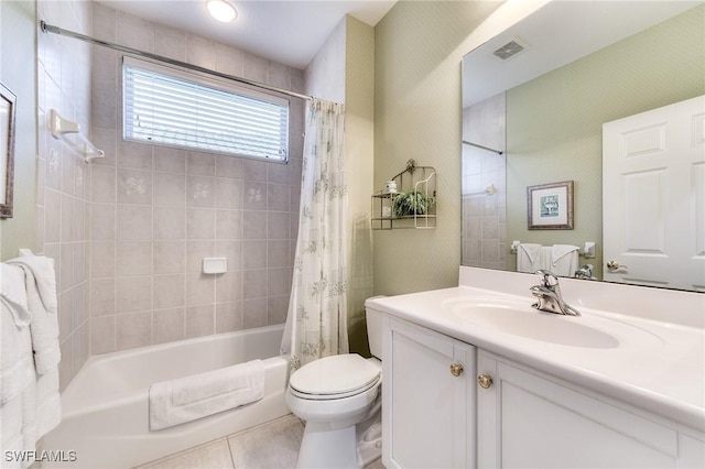 full bathroom with vanity, toilet, tile patterned floors, and shower / bath combo