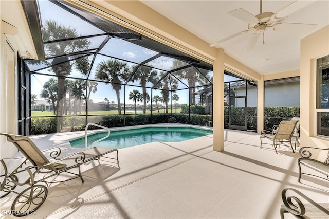 view of swimming pool with a lanai and a patio