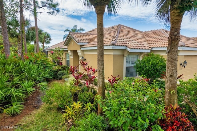 view of side of home featuring a garage