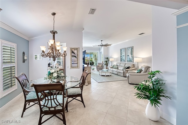 tiled dining room featuring ceiling fan with notable chandelier and ornamental molding