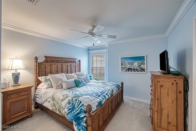 carpeted bedroom featuring ceiling fan and ornamental molding