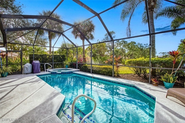 view of pool featuring a lanai, a patio area, and an in ground hot tub