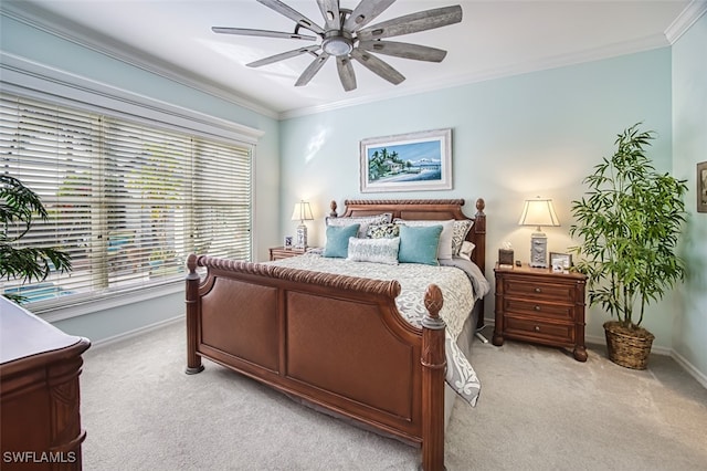 bedroom featuring ceiling fan, light colored carpet, and ornamental molding