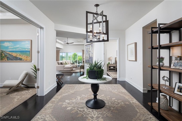 interior space featuring dark hardwood / wood-style floors and a notable chandelier