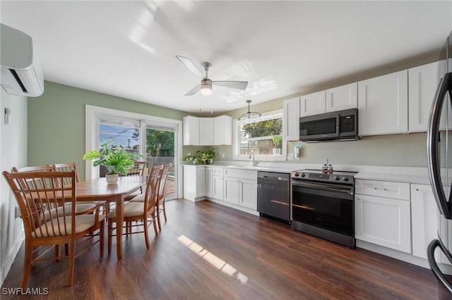 kitchen featuring ceiling fan, plenty of natural light, white cabinets, and stainless steel appliances