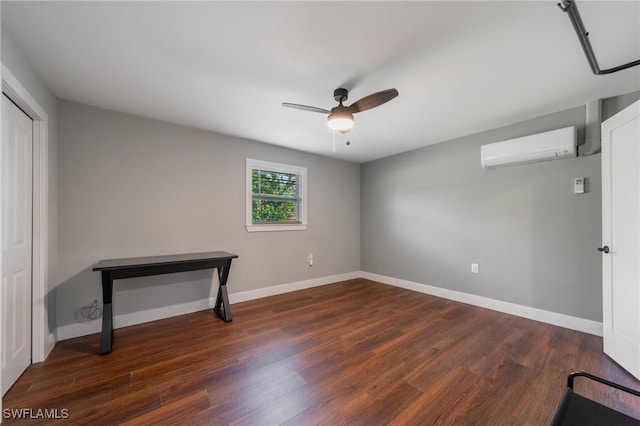 bedroom featuring a wall mounted AC, dark wood-type flooring, and ceiling fan