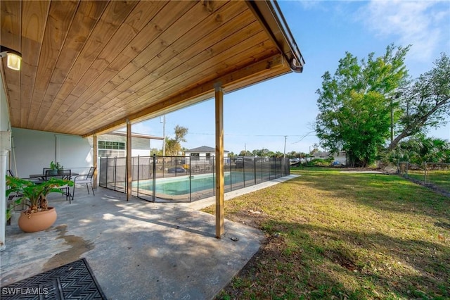 view of patio with a fenced in pool