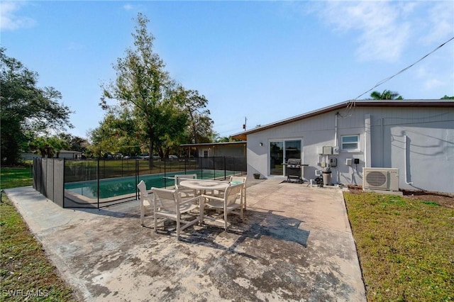 view of pool featuring ac unit, a patio, and grilling area