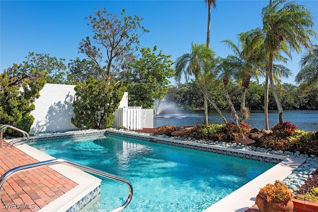 view of pool with a water view