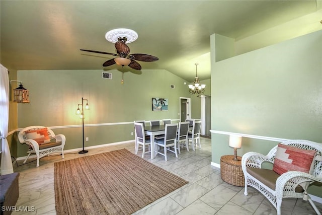 living room featuring ceiling fan with notable chandelier and vaulted ceiling