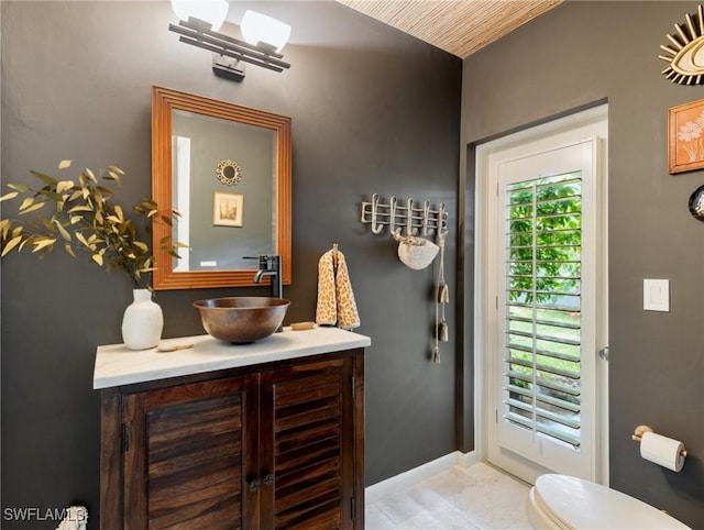 bathroom with toilet and vanity