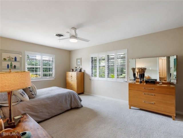 carpeted bedroom featuring ceiling fan