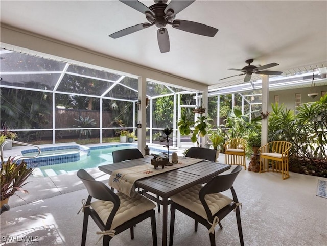 view of swimming pool with a lanai, a patio area, and an in ground hot tub