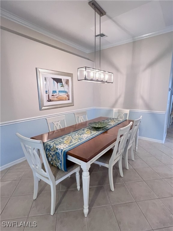 tiled dining space with crown molding