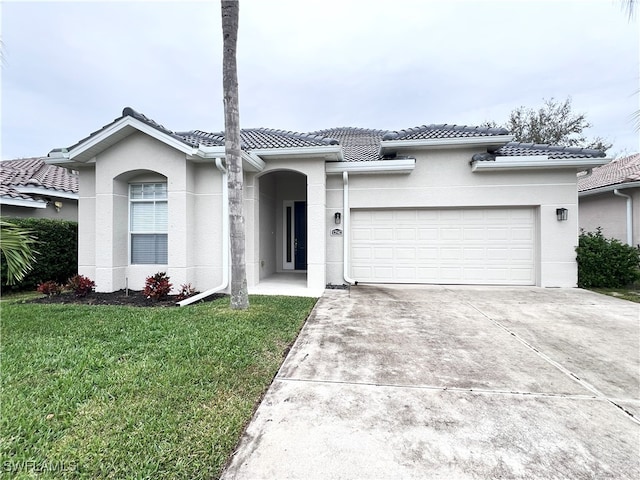 view of front facade with a front lawn and a garage