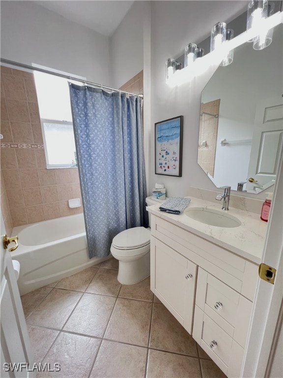 full bathroom featuring toilet, tile patterned flooring, shower / bath combination with curtain, and vanity