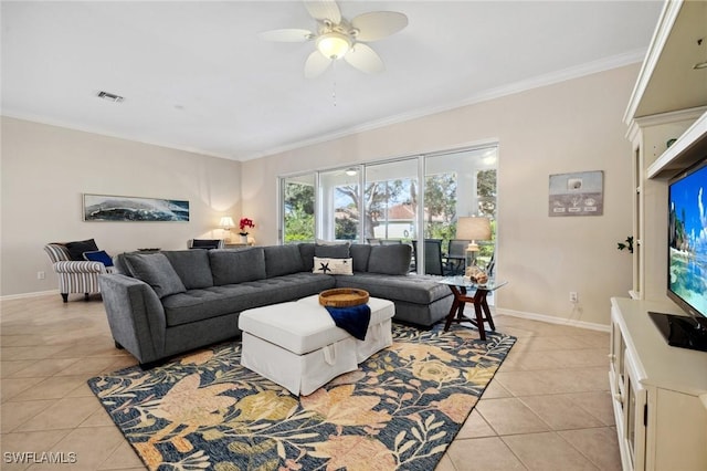 living room with ceiling fan, ornamental molding, and light tile patterned floors