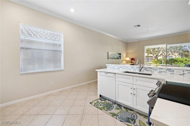 kitchen with light tile patterned flooring, sink, white cabinets, ornamental molding, and white dishwasher