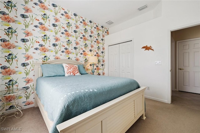 carpeted bedroom featuring a closet