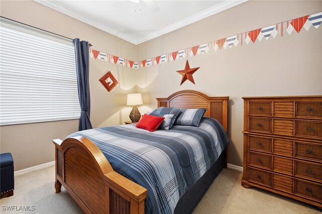 bedroom featuring light carpet, crown molding, and ceiling fan