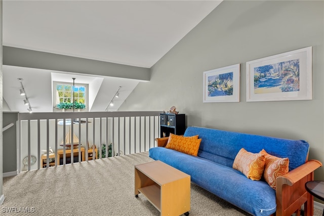 living area with carpet floors, track lighting, and lofted ceiling