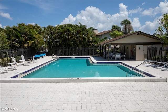 view of swimming pool with a patio