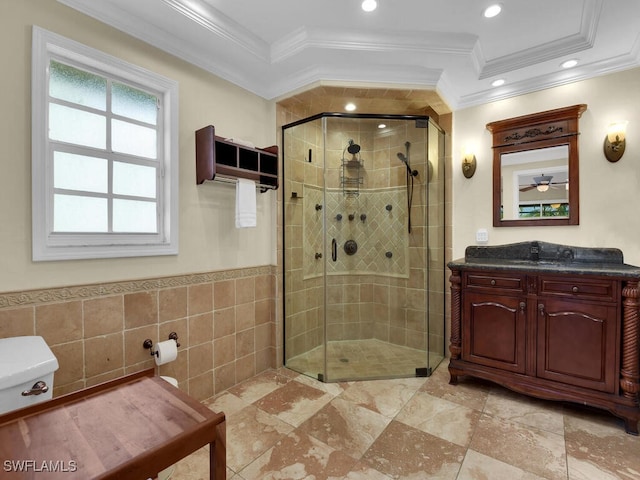 bathroom featuring crown molding, vanity, walk in shower, and tile walls