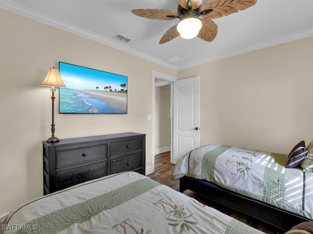 bedroom with ceiling fan, ornamental molding, and dark hardwood / wood-style floors