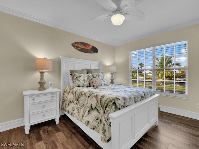 bedroom with dark wood-type flooring, ceiling fan, and ornamental molding