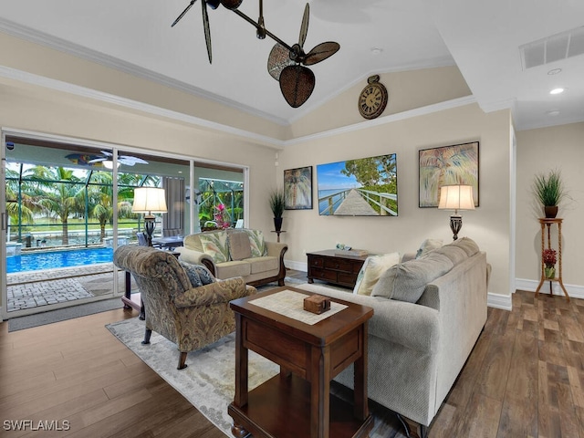 living room with vaulted ceiling, ceiling fan, and hardwood / wood-style flooring