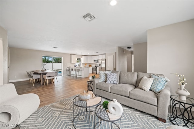 living room with hardwood / wood-style floors