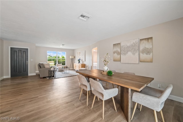 dining space featuring hardwood / wood-style flooring