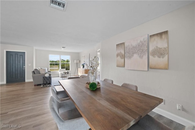 dining area with wood-type flooring