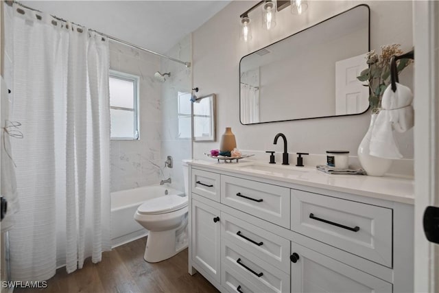 full bathroom featuring toilet, vanity, shower / tub combo with curtain, and hardwood / wood-style floors