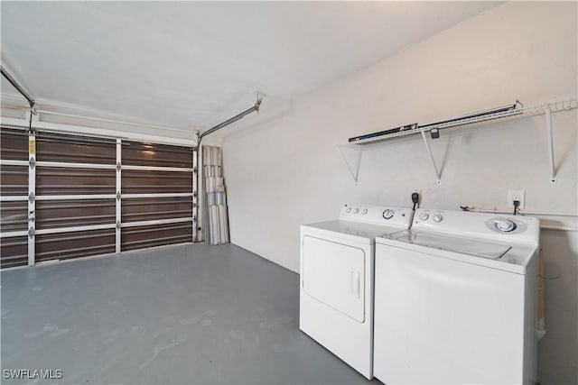 clothes washing area with washer and dryer