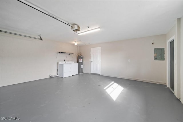 garage featuring electric water heater, electric panel, independent washer and dryer, and a garage door opener