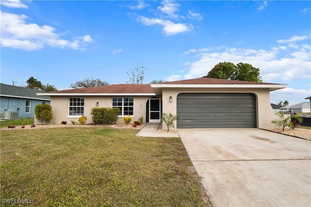 ranch-style house featuring a garage, a front lawn, and central AC