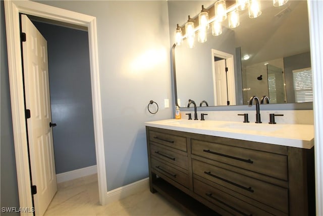 bathroom featuring vanity and an enclosed shower