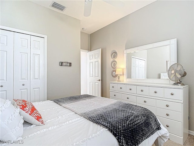 bedroom featuring carpet flooring, ceiling fan, and a closet