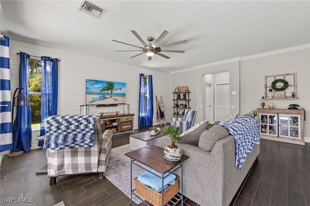 living room featuring ceiling fan and ornamental molding