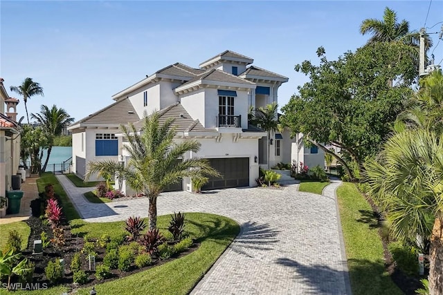 view of front of home featuring a garage and a front lawn