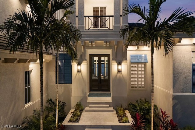 exterior entry at dusk with french doors