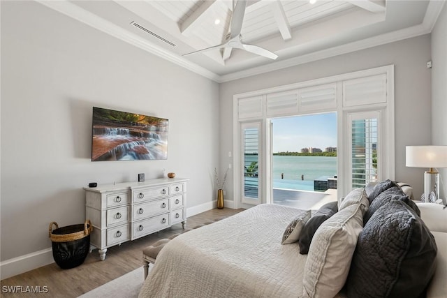 bedroom featuring access to outside, beamed ceiling, a water view, ceiling fan, and wood-type flooring