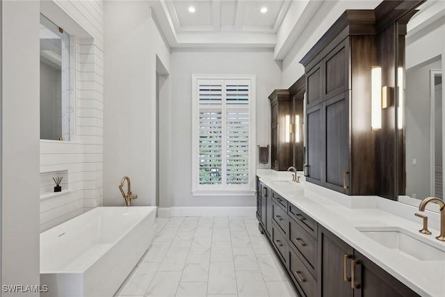 bathroom featuring beam ceiling, a bathtub, coffered ceiling, and vanity