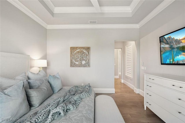 bedroom with light hardwood / wood-style floors and crown molding