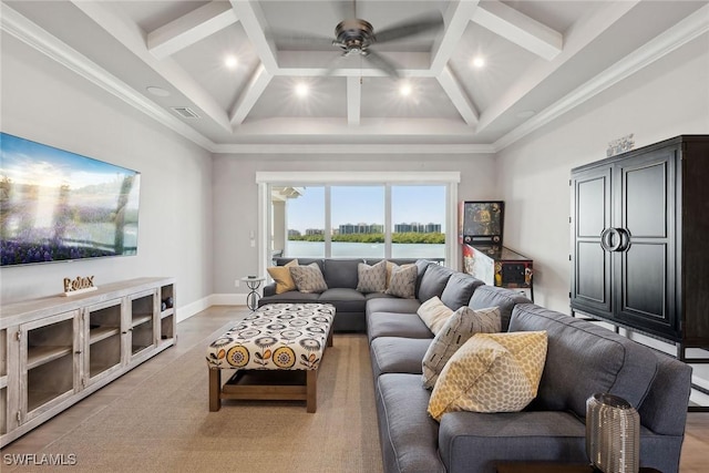 living room featuring a high ceiling, ceiling fan, crown molding, and coffered ceiling