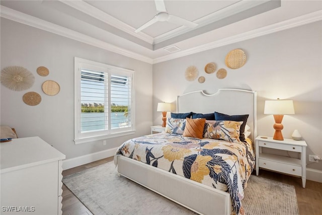 bedroom featuring ornamental molding, ceiling fan, and wood-type flooring