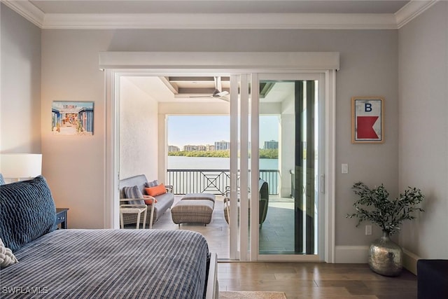 bedroom featuring ornamental molding, hardwood / wood-style flooring, and access to exterior