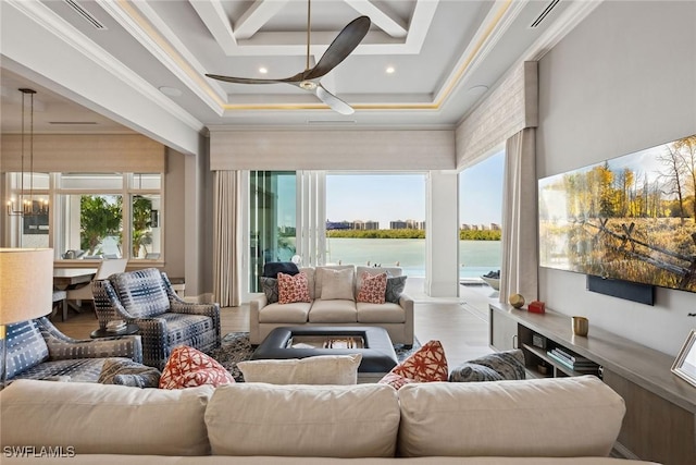 sunroom / solarium featuring ceiling fan with notable chandelier